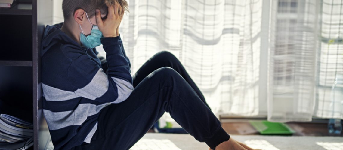 Depressed little boy sitting by the window, wearing surgical mask. During quarantine in COVID-19 coronavirus outbreak there is huge psychical pressure on everybody.
Nikon D850